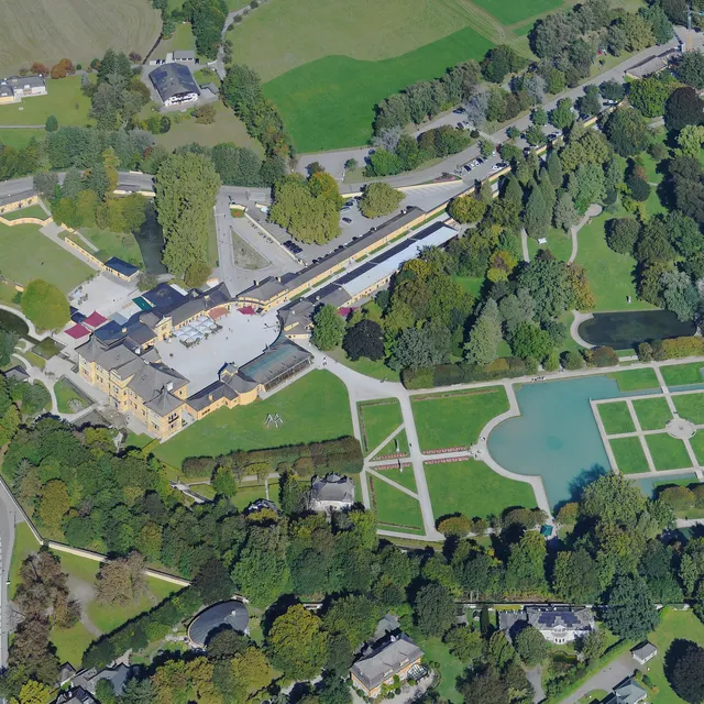 Aerial view of Hellbrunn Palace, its gardens and the park from the south