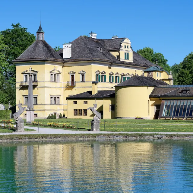Schloss Hellbrunn reflected in the pond in front of the palace