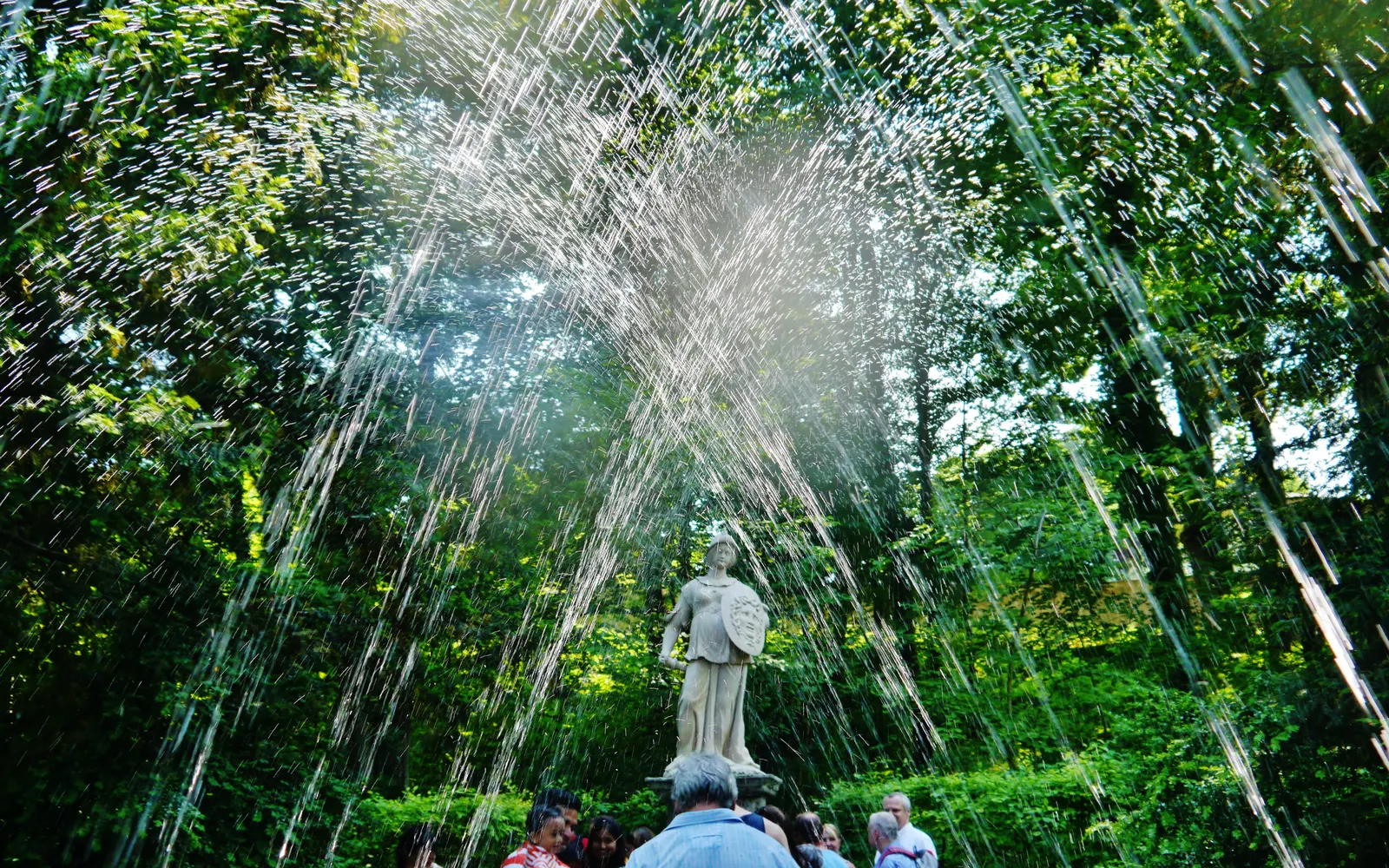 Visitors caught by the hidden jets of the Hellbrunn trick fountains